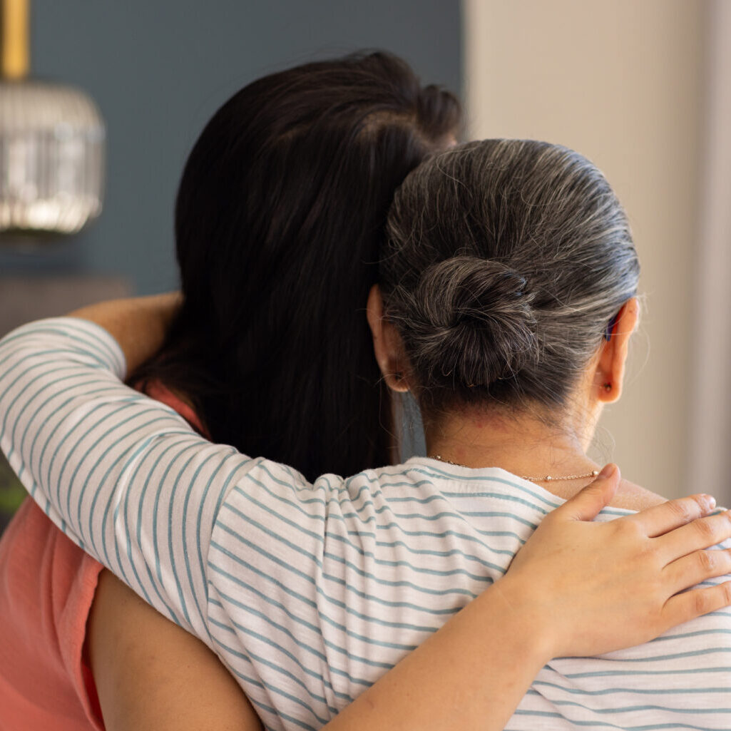 Embracing, asian grandmother and granddaughter showing support and comfort in heartfelt moment. love, friendship, empathy, connection, bonding, togetherness