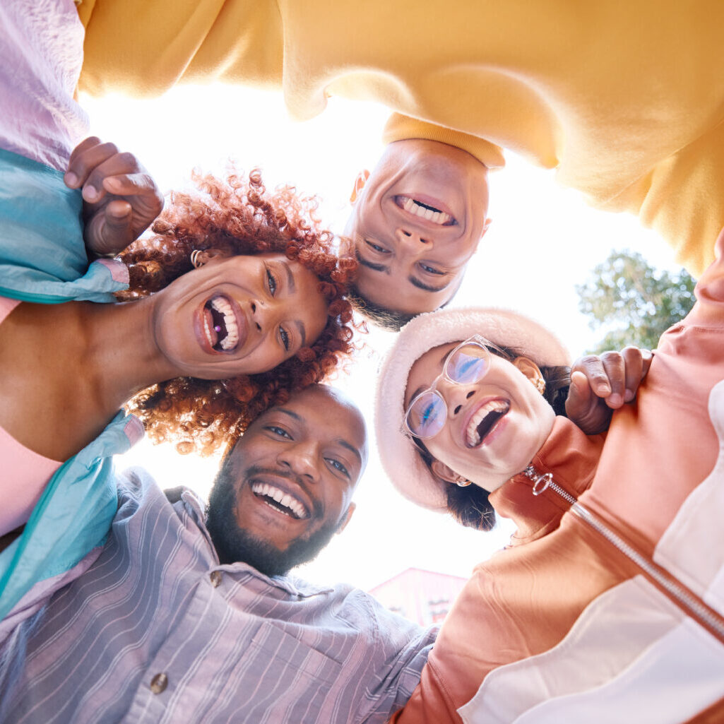 Portrait, smile and a group of friends in a huddle outdoor together for freedom, bonding or fun fro.